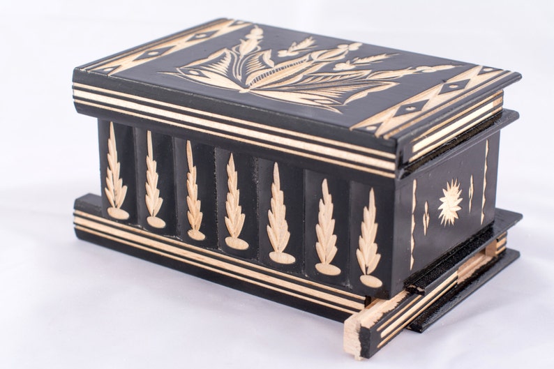 puzzle box with hidden compartment