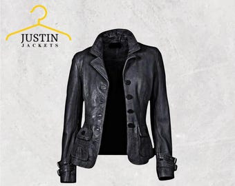 May include: A black leather jacket with a classic design. The jacket features a notched collar, button closure, two front pockets, and adjustable cuffs. The text "JUSTIN JACKETS" is above the jacket.