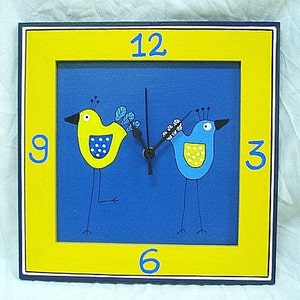 Blue And Yellow Love Birds On A Wooden Wall Clock
