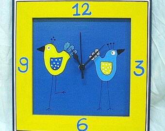 Blue And Yellow Love Birds On A Wooden Wall Clock