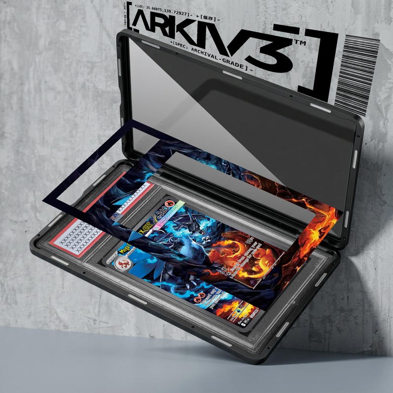 May include: A black archival-grade case with the text "ARKIV3" and "SPEC: ARCHIVAL-GRADE" is open, revealing a graded trading card. The card features a blue and orange fantasy illustration. A barcode and additional text are visible.
