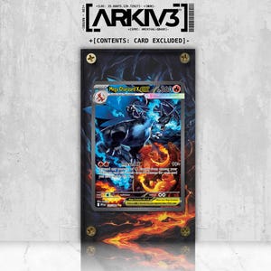 May include: A framed Mega Charizard X EX trading card. The card features a fiery dragon illustration with blue and orange hues. The frame is black with gold-colored screws. The text "ARKIV3" is visible at the top.