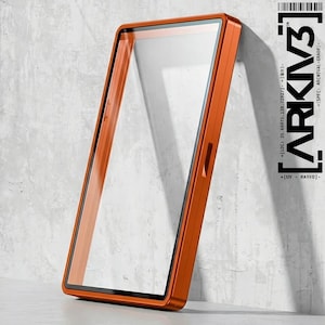May include: An orange rectangular phone case with a clear screen protector. The case has a sleek, modern design with a black border around the screen. The text "ARKIV3" is printed vertically on the right side of the case.