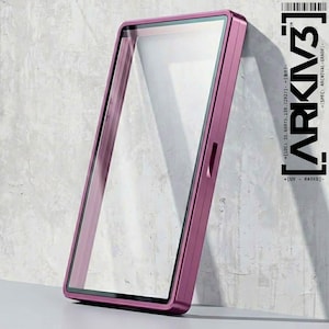 May include: A rectangular, magenta-colored phone case with a clear screen protector. The case has a slim profile and a metallic finish. The text "ARKIV3" and other technical details are printed on the right side.