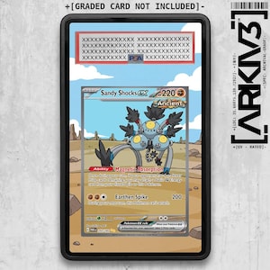 May include: A Sandy Shocks ex trading card encased in a black protective slab. The card features a gray, multi-eyed creature with long legs against a desert background. Text includes Sandy Shocks ex, 220 HP, Magnetic Absorption, and Earthen Spike.