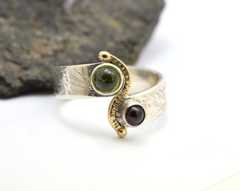 Sterling silver and gold garnet and peridot ring, Dual stone on a wrap textured band with red and green stone size 6, two stone by pass ring