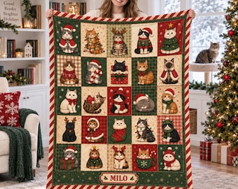May include: A rectangular throw blanket featuring a grid of twenty-five individual illustrations of cats in various Christmas-themed outfits and settings, with a red and white striped border and the name MILO printed at the bottom center.