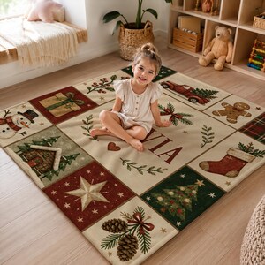 May include: A square area rug featuring a grid of Christmas-themed illustrations including a snowman, a gift, a red truck, a gingerbread man, a stocking, a star, a pine tree, and pinecones, with the name Olivia printed in the center.