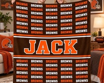 May include: A brown and orange fleece blanket featuring a repeating pattern of the word BROWNS in white and orange text. The center of the blanket displays the name JACK in large orange block letters outlined in white on a brown background.