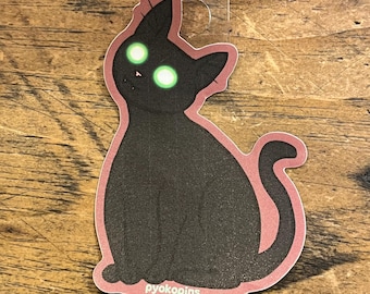 Flashlight Eyes black cat sticker