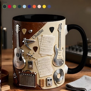 May include: A ceramic mug with a black interior and handle, featuring a guitar-themed design. The design includes miniature guitars, music sheets, and guitar accessories. The name "Charlie" is printed on the mug.