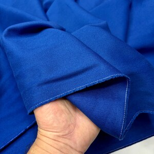 Blue denim fabric edges and weave texture