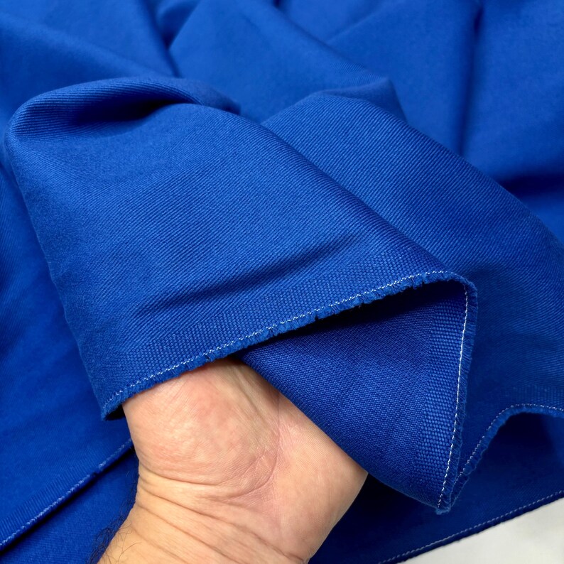 Blue denim fabric edges and weave texture