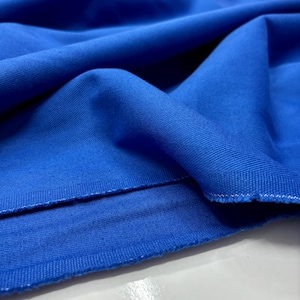 Bright blue denim fabric draped softly