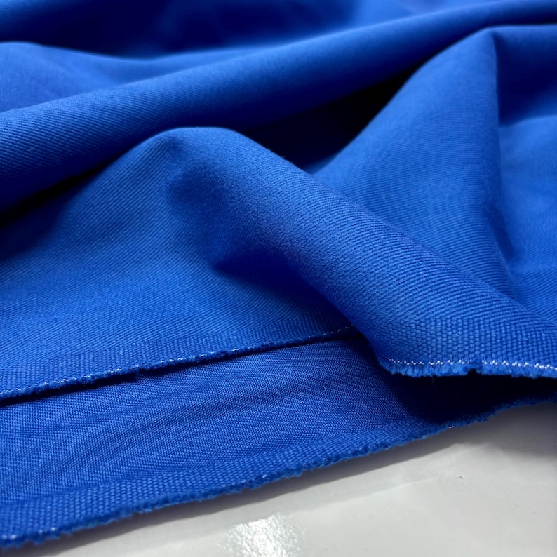 Bright blue denim fabric draped softly