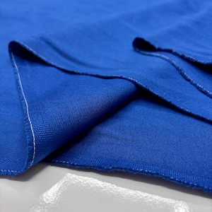 Thick blue denim fabric detail shot