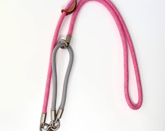 Correa de nailon para teléfono, ajustable libremente, color rosa vibrante y gris claro.