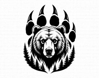 May include: A black and white graphic illustration featuring the head of a bear centered within a large bear paw print. The design incorporates silhouettes of pine trees along the lower edges, creating a detailed and high-contrast nature-themed image.