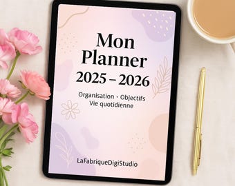 May include: A digital planner displayed on a tablet, featuring the text "Mon Planner 2025-2026" in black. The planner's cover has a soft pink and beige design with floral accents. A gold pen and a cup of coffee are next to the tablet, with pink flowers in the background.