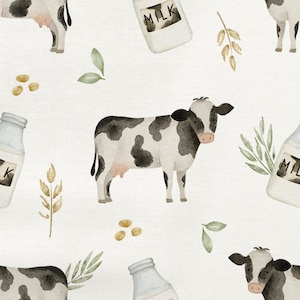 May include: A repeating pattern with watercolour illustrations of cows, milk bottles, wheat stalks, and leaves. The cows are black and white, and the milk bottles have the word "MILK" on them. The background is a light cream colour.