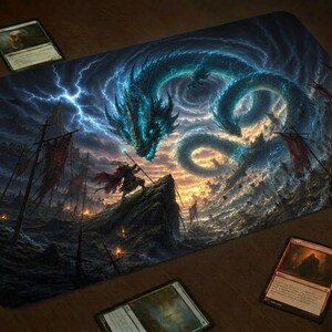 May include: A rectangular playmat featuring a fantasy illustration of a large, glowing blue serpentine dragon hovering above a rocky cliff. A lone figure stands on the cliff holding a staff, surrounded by dark storm clouds, lightning, and ships.