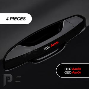 May include: A glossy black car door handle cover featuring the Audi logo and text in white and red. The set includes 4 pieces, as indicated by the text in the upper left corner. A small rectangular graphic in the bottom right displays the Audi logo.