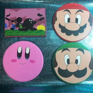 Nintendo themed woodburned plaques featuring Kirby and Super Mario