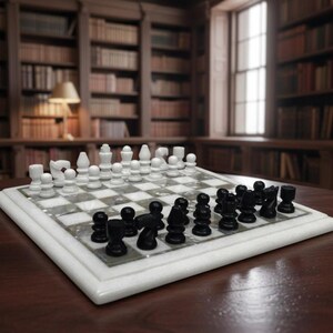 May include: A marble chess set with black and white pieces arranged on a checkered board. The board is white with grey squares and sits on a dark wooden table. The background features a library with bookshelves.