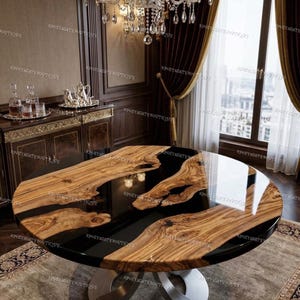 May include: A circular dining table with a wooden top and a black resin river design. The table has a polished finish and a silver metal pedestal base. The room features a chandelier and a window with curtains.