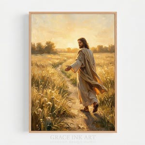 May include: A vertical framed art print depicting a figure with long hair and a beard, wearing a flowing beige robe, walking along a dirt path through a golden wheat field at sunset. The text Grace Ink Art is printed at the bottom of the frame.