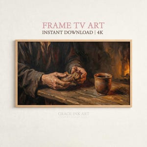 May include: A framed digital art print depicts a person's hands breaking bread, with a cup on a wooden table. The artwork has a warm, earthy color palette with brown and gold tones. The text "FRAME TV ART" and "INSTANT DOWNLOAD | 4K" is at the top.