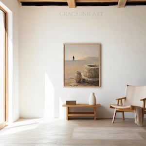 a serene and minimalist living room with a large window, a wooden bench, a white armchair, and a framed painting of a desert landscape hanging on the wall.