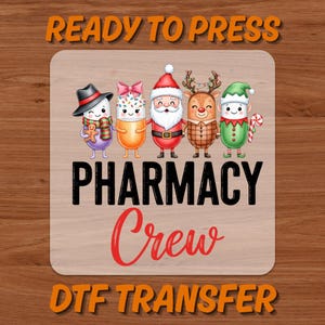 May include: A DTF transfer featuring the text "READY TO PRESS" and "DTF TRANSFER" in orange, with "PHARMACY Crew" in black and red. The design includes cartoon pill characters dressed as Christmas figures, including Santa, a reindeer, and an elf.