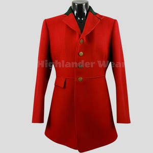 May include: A red riding coat with a green collar and gold buttons. The coat has a tailored fit and a single pocket. The text "Highlander Wear" is printed on the coat.