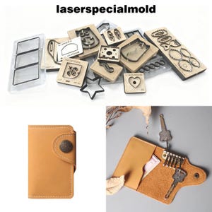 Op de afbeelding: Een assortiment lasergesneden mallen en lederwaren. De mallen bevatten verschillende vormen en ontwerpen, zoals een kat, een hart en een ster. De lederwaren zijn een beige kaarthouder en een beige sleutelhouder.