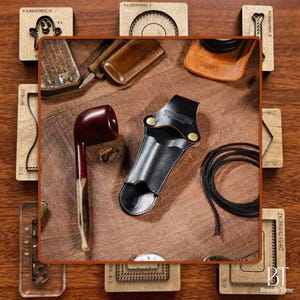 May include: A collection of tobacco pipes and accessories, including a dark red pipe, a black leather pipe holder, and a black cord. Wooden stamps and leather goods are also visible, all arranged on a wooden surface.