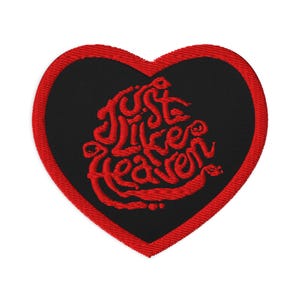 May include: Red heart-shaped patch with black fabric and red embroidered text that reads "Just Like Heaven".