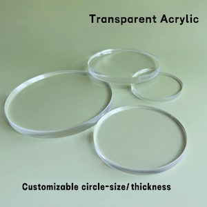 May include: A collection of transparent acrylic circles of varying sizes. The image includes the text "Transparent Acrylic" and "Customizable circle-size/ thickness". The circles are clear and appear to be smooth.