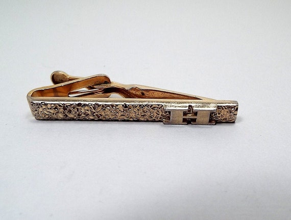 Vintage Midcentury Mens Designer Gold Tone Tie Bar Clasp by Swank Textured Patina with Engraved Detail
