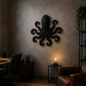 May include: A matte black, geometric, low-poly wall sculpture of an octopus with eight curled tentacles. The sculpture features a faceted, angular surface design and is mounted centrally on a textured, neutral-toned wall surface.