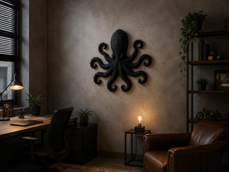 May include: A matte black, geometric, low-poly wall sculpture of an octopus with eight curled tentacles. The sculpture features a faceted, angular surface design and is mounted centrally on a textured, neutral-toned wall surface.
