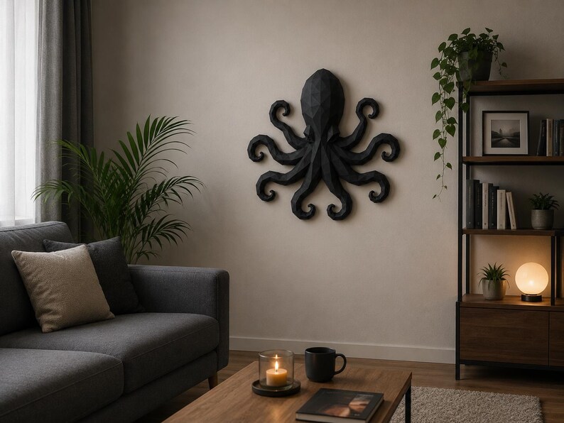 May include: A black, geometric, low-poly wall sculpture of an octopus with eight curled tentacles. The piece features a faceted, angular surface design and is mounted centrally on a plain, light-colored wall above a wooden coffee table.