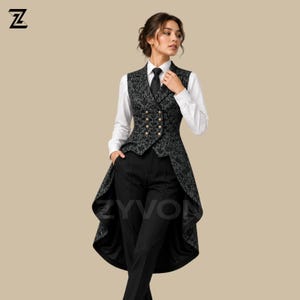 May include: A long-tailed vest featuring a dark gray and black floral brocade pattern with double-breasted gold buttons, worn over a crisp white long-sleeved button-down shirt with a black necktie and solid black trousers. The ZYVON logo is visible.
