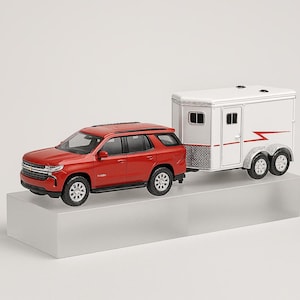 May include: A red SUV pulling a white horse trailer. The SUV has black wheels and a silver grill. The trailer has two axles and a red lightning bolt design. The trailer has a silver diamond plate on the bottom.