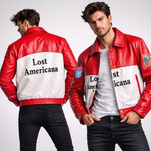 May include: A red and white leather jacket with the text "Lost Americana" on the back. The jacket has a classic design with a collared neckline and a patch on the sleeve. The model is wearing black jeans.
