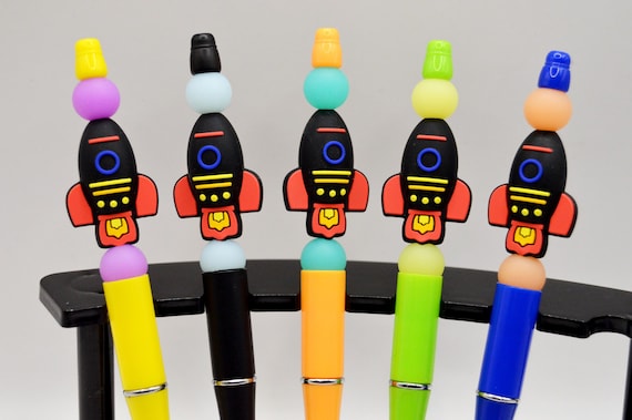 Rocket Ship Pens that Glow in the dark.