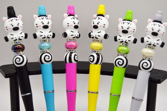 Colorful Zebra Pens, black ink, soft beads, swirl