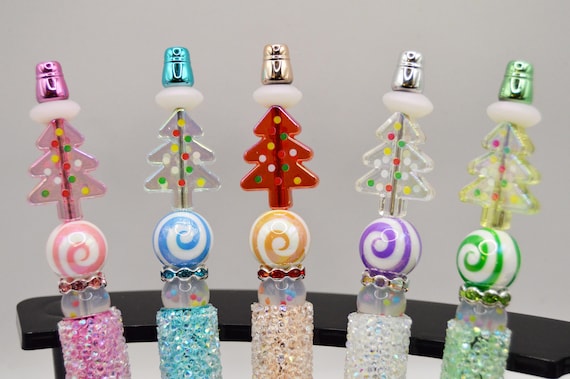 Poke-a-dot candy tree pens with bright colors and swirls!