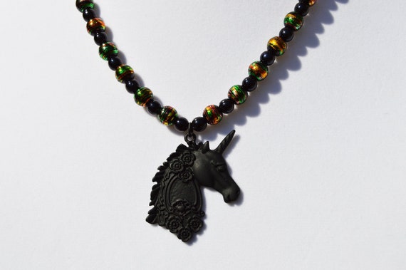 Beautiful black unicorn necklace with gorgeous gold swirled glass beads, Dark , Elegant