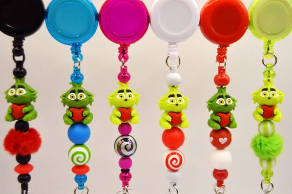 Reel Badge Holder with adorable little Grinch baby holding a hart, pretty, fun, holiday, winter, christmas